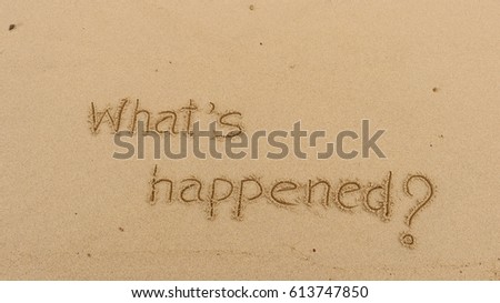 Handwriting words "What's happened?" on sand of beach Royalty-Free Stock Photo #613747850