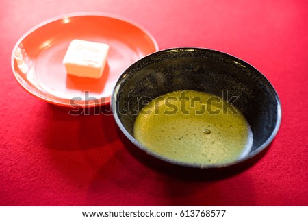 Japanese Matcha traditional green tea serving with dessert.