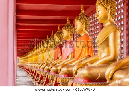 Many golden buddha statue in thailand