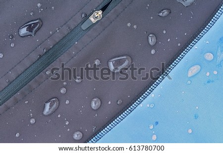 Detailed view of  softshell jacket with water drops, zipper and seams. Royalty-Free Stock Photo #613780700