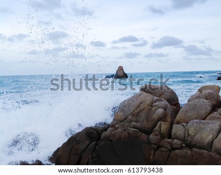 Waves hit rocks