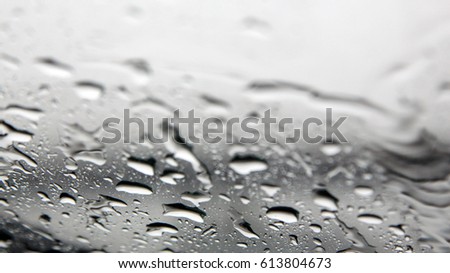 Water drops on the car window glass after rain with selected focus - depth of field