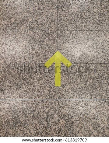 The light green arrow as transportation sign on the granite floor