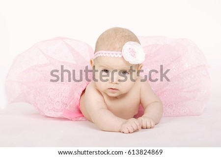 photo of sweet little ballerina on white background