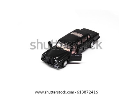 black mini toy car open two doors on white background with clipping path