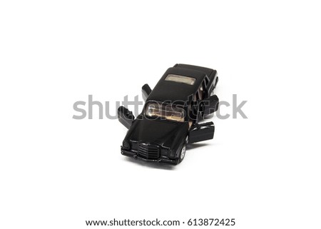 black mini toy car open four doors on white background with clipping path