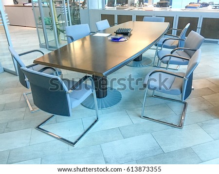 Chairs near a meeting room table.