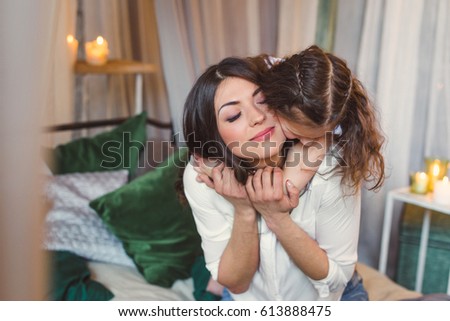 Mom and daughter are hugging in bed. Close-up. Little girl hugging her mother in the bed. Happy family in the bed. daughter hugging mother
 Royalty-Free Stock Photo #613888475