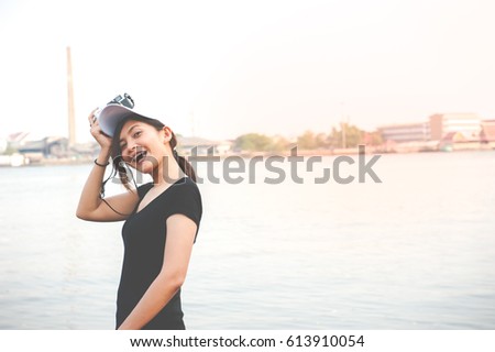 Hipster woman taking photos with retro film camera ,Girl Adventure Hangout Traveling Holiday Photography Concept