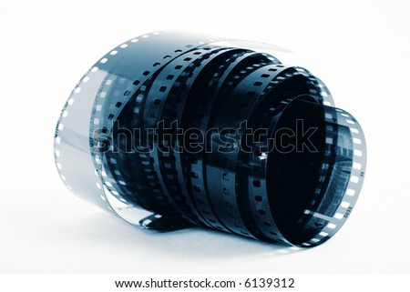 Closeup image of curling 35mm film in blue tones