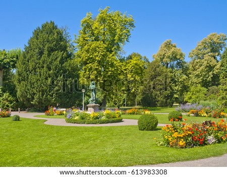 Public garden (Parc de l'Orangerie) in Strasbourg, France in summer Royalty-Free Stock Photo #613983308