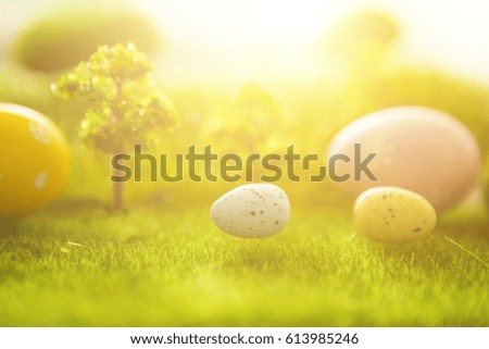 Easter bunny with eggs on a meadow in spring. Close-up.
