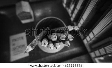 Wooden brown pencils in black and white vintage photo.