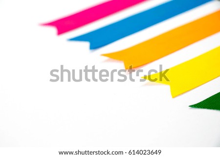 Colorful ribbon (Pink, blue, orange, yellow, green) on white background