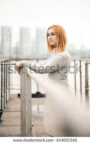 Girl on an old concrete bridge