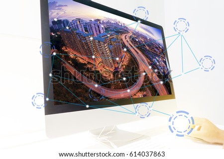 World wide graphic connection and communication concept. Cityscape connection concept blending with computer desktop.