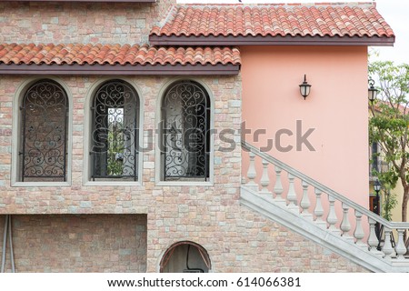Europe Italian style stone house building with arch and windows  Royalty-Free Stock Photo #614066381
