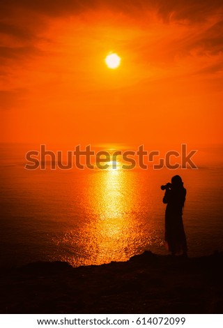 Silhouette photographer take photo at sunset in Phuket,Thailand.