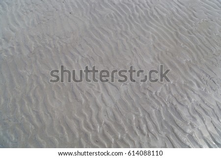Sand wave by sea on the beach.