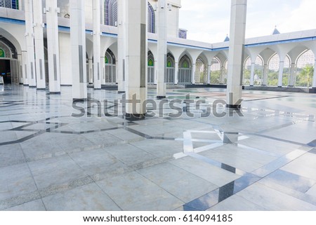 Shining floor marble reflection at mosque corridor