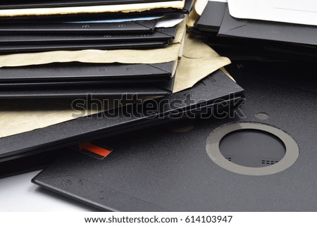 A lot of very old vintage 5¼-inch floppy disk on white background.