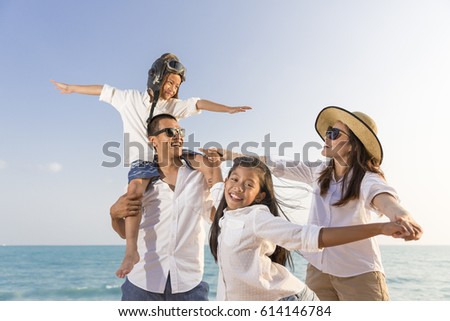 Asian happy family enjoy relaxing on the beach, Concept of happy family and lifestyle,Concept of happy family travel Royalty-Free Stock Photo #614146784