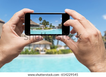taking picture of vacations in caribbean resort