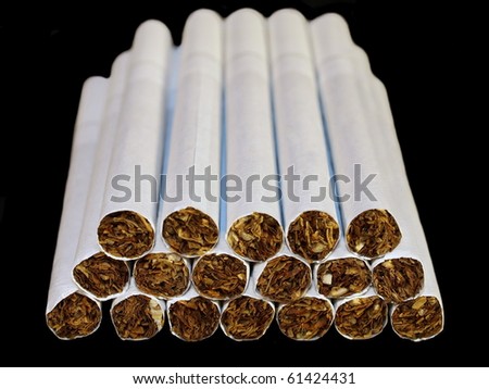 Smoking cigarettes isolated on black background