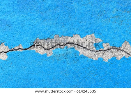 Blue concrete wall with a crack, background, texture