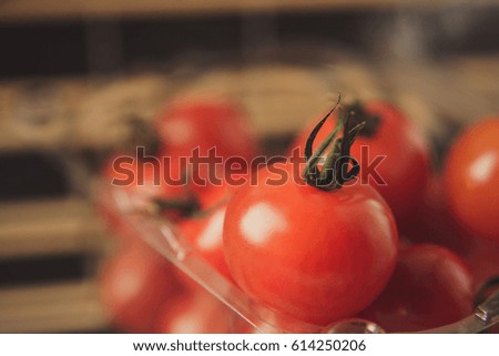 the cherry tomatoes in a plastic box