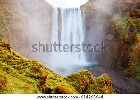 Lovely view of famous Skogafoss waterfall and scenic surroundings. Dramatic and picturesque scene. Popular tourist attraction. Location place Skoga river, highlands of Iceland, Europe. Beauty world.