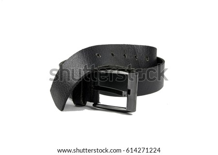 Black trouser belt, folded, isolated on white background. Royalty-Free Stock Photo #614271224