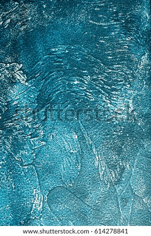 Rough concrete background in dark and light blues, textured