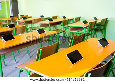 Digital tablet on the desk in classroom