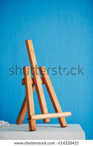 Easel on a blue background