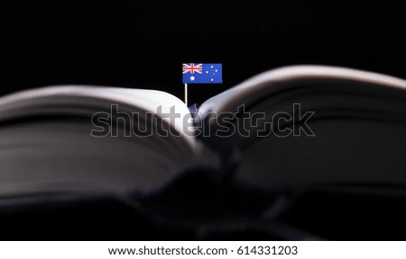 Australian flag in the middle of the book. Knowledge and education concept.