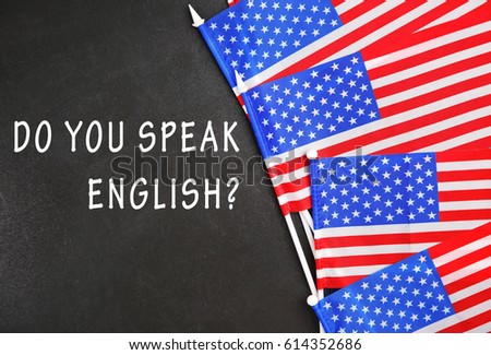USA flags and question DO YOU SPEAK ENGLISH on blackboard background