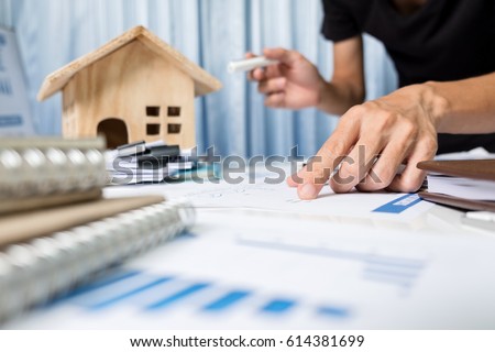 Manager working in the office ,property for sale concept. Royalty-Free Stock Photo #614381699