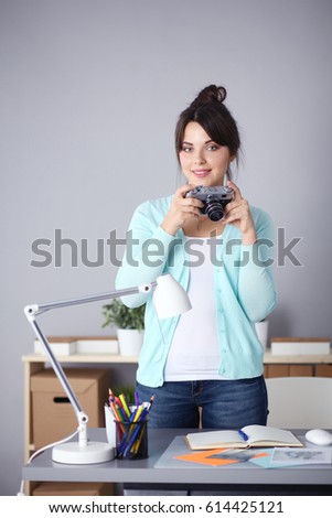 Woman is a proffessional photographer with camera
