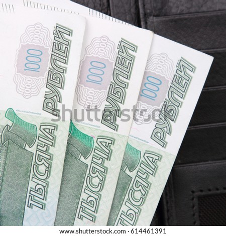 Russian money in black wallet