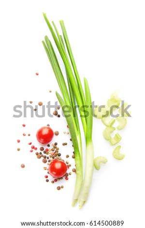 Mediterranean food & drink healthy lifestyle concept:  Italian herbs vegetables spices. Top view. Isolated on white. Green onion cherry tomatoes peppers celery Royalty-Free Stock Photo #614500889