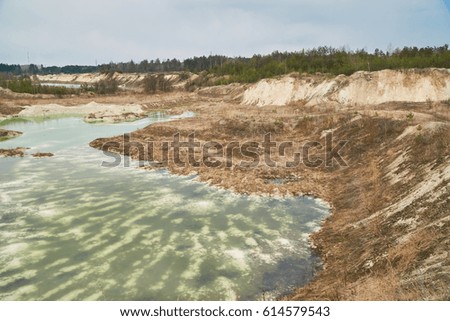 Old quarry with turquoise water.                               