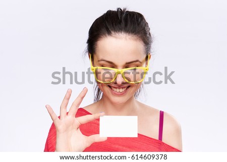 smiling  woman in glasess with business card                                