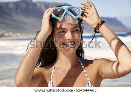 Bikini babe at beach with diving mask