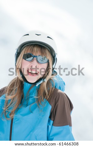 Happy young girl on ski