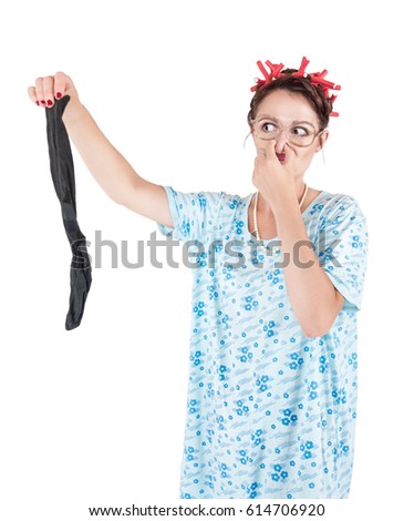 Funny stereotypical housewife with man sock bad smell isolated
