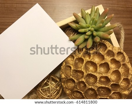 Black white paper on wood and gold decorating accessories
