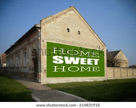 Home Sweet Home. The old farmhouse. Motivation, poster, quote, billboard, green background, white letters, blurred image