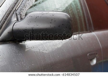 Left side mirror on an old gray car