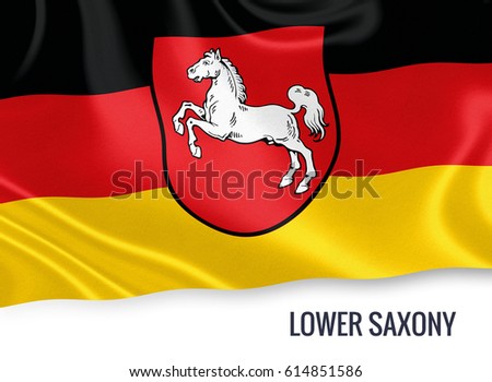 Flag of German state Lower Saxony waving on an isolated white background.